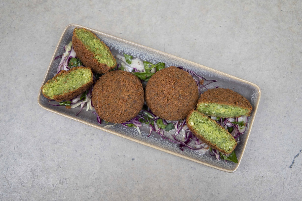 Authentic Egyptain falafel made with fava beans served with tahini dip and salad